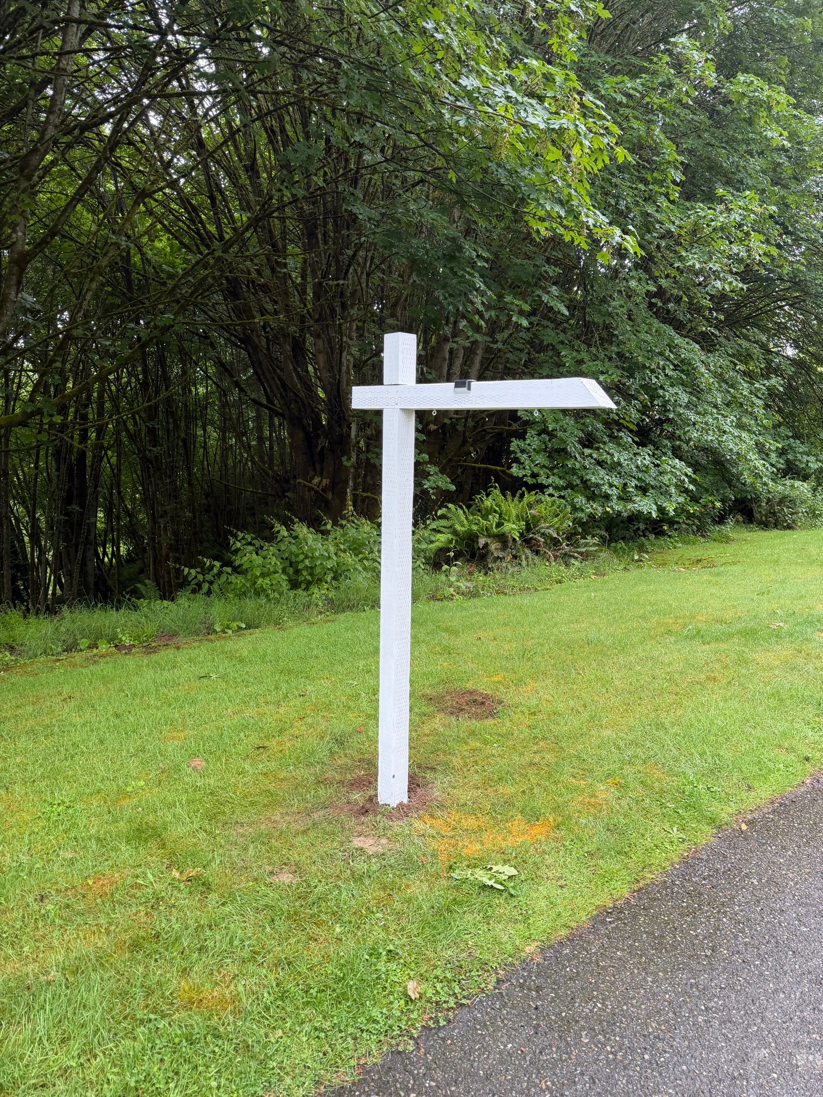 North Shore Sign Co listing sign installation at a residential property