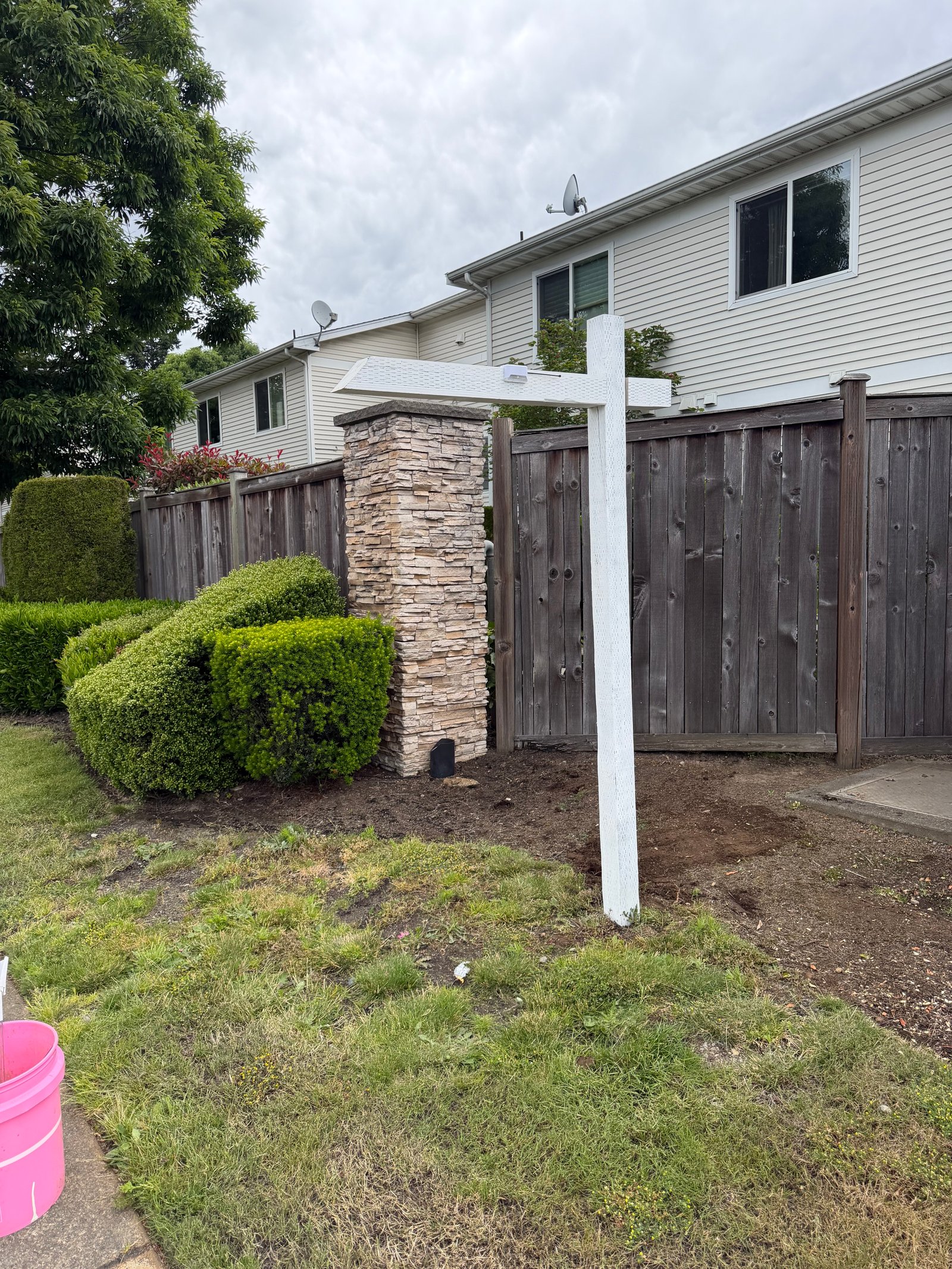 Custom branded signpost installed for residential listing