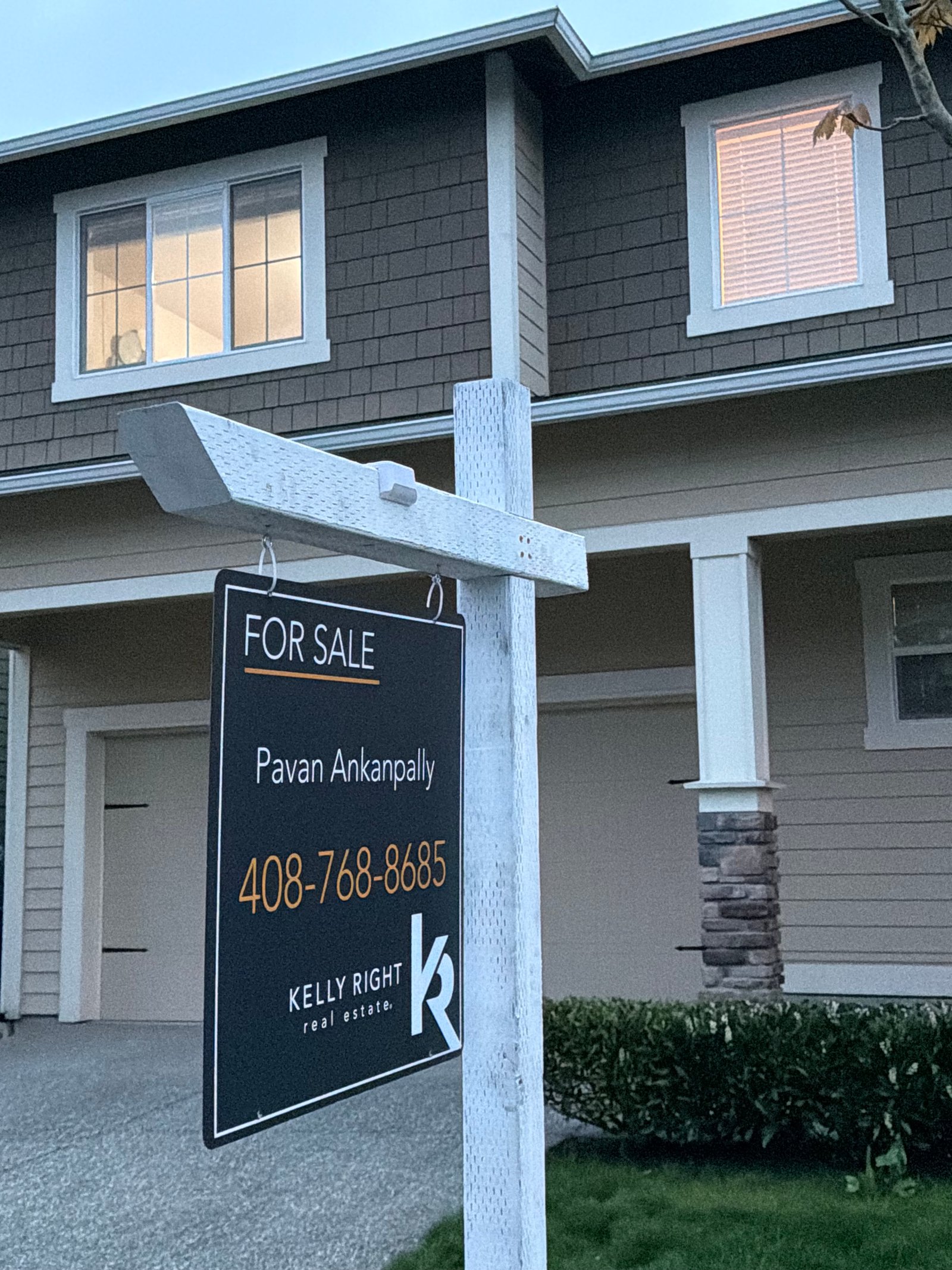 Listing sign installation completed near residential driveway
