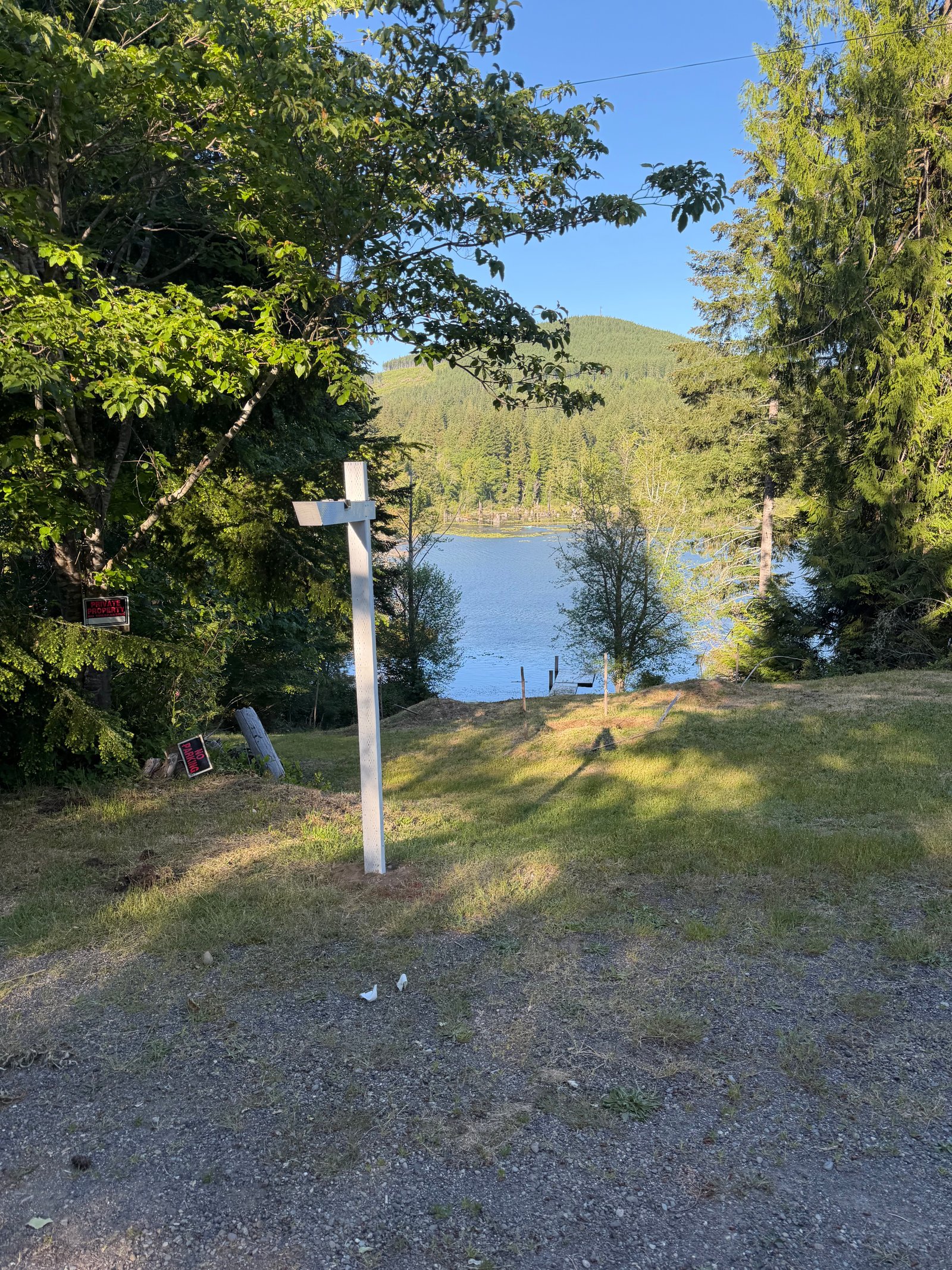 North Shore Sign Co signpost standing on landscaped front lawn